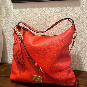 Gorgeous Orange Leather Michael Kors Bag w/Gold hardware accents and Tassel.
